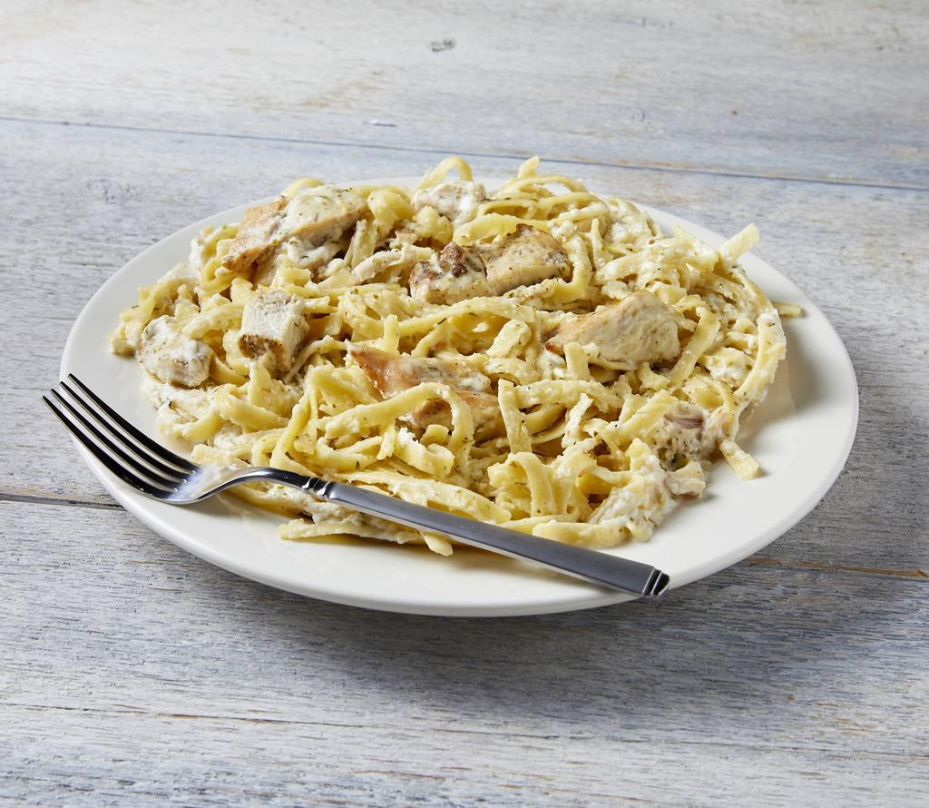 Fettuccini Chicken Alfredo · Fettuccini pasta with chicken covered in our homemade Alfredo sauce topped with Parmesan cheese.