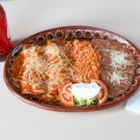 Enchiladas Plate · 2 pieces. Choice of meat, chicken or beef, sour cream, rice and beans.