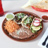  Tacos Plate · 2 pieces. Served with rice, beans, cheese, 2 meat tacos, onion, cilantro and chile.