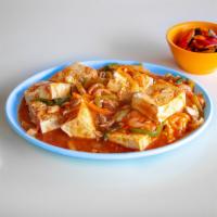 Spicy Tofu · Tofu slices with vegetables basted in hot sauce. Spicy. 
