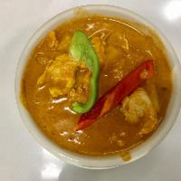 Pineapple Curry · Pineapple, bell peppers and basil leaves in red curry and coconut milk.