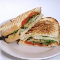 Veggie Panini · A vegetable medley of zucchini, squash, roasted red peppers, green peppers, mushrooms & onio...