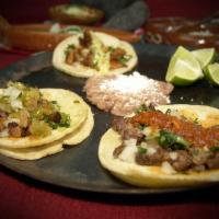 Tacos ·  Street tacos: *Asada, Pastor or Marinated Grilled Chicken topped with onion and cilantro. ....