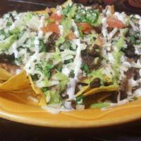 Los Nachos · *Asada, Marinated Chicken, Pastor (pork) or Vegetarian (Bean & Cheese)  served with pinto be...