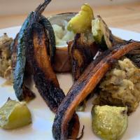 Giardino di Verdure · Variety of different flavored
vegetables garden: charred eggplant, ,grilled lemon carrots, o...