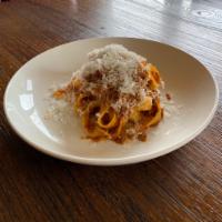 Tagliatelle alla Bolognese · Home-made pasta, bolognese beef-pork ragu, Parmigiano Reggiano