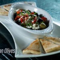 Mixed Moroccan Olives · A combination of bitter black oil cured olives and green olives topped with feta, roasted re...