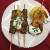 Sultan Kabob Feast · A platter of kabobs: chicken, lamb, beef steak shrimp and a kefta patty spiced ground beef e...