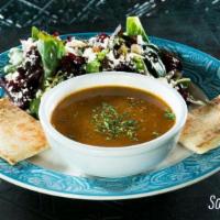Soup & Salad Lunch · A steaming bowl of lentil soup and house salad.