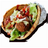 Falafel on Pita · Freshly cooked all vegetarian, deep fried to perfection, consisting of ground chick peas and...