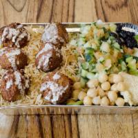 Falafel over Rice · Freshly cooked all vegetarian, deep fried to perfection, consisting of ground chick peas and...