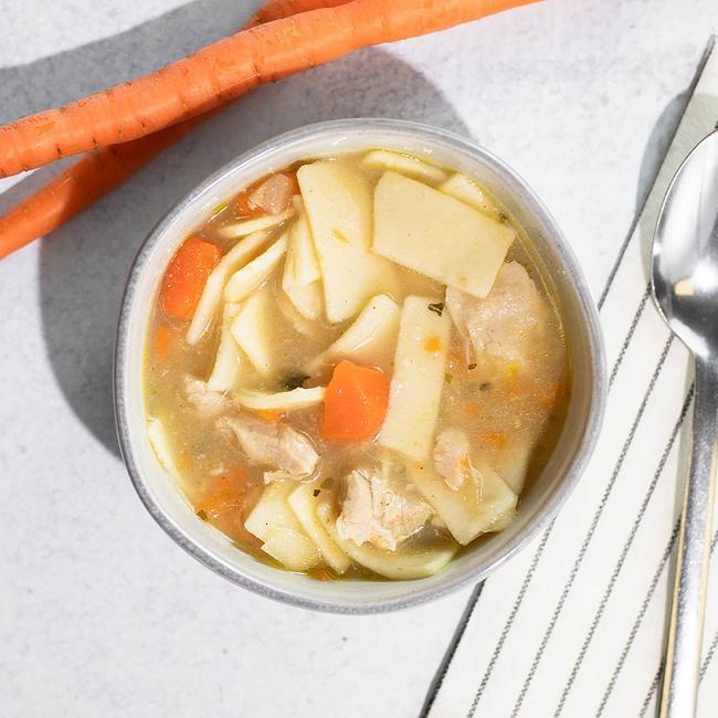 Chicken Noodle Soup · Organic Chicken Stock, Water, Organic Chicken, Organic Carrots, Organic Onions, Organic Pasta, Organic Celery, Contains 2% or less of: Organic Butter, Organic Garlic, Organic Basil, Organic Parsley, Organic Cornstarch and Organic Spices.