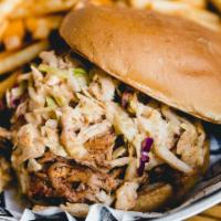 Carolina Pulled Pork Sandwich · Smoked pork shoulder topped with spicy cole slaw, Bubba’s Carolina sauce, toasted bun.