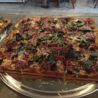 Large Calabrese Pizze · Soppressata, red onions and Kalamata olives topped with fresh basil, Parmigiano Reggiano and...