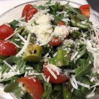 Asparago Salad · Grilled asparagus, arugula and cherry tomato topped with shaved Parmigiano Reggiano cheese a...