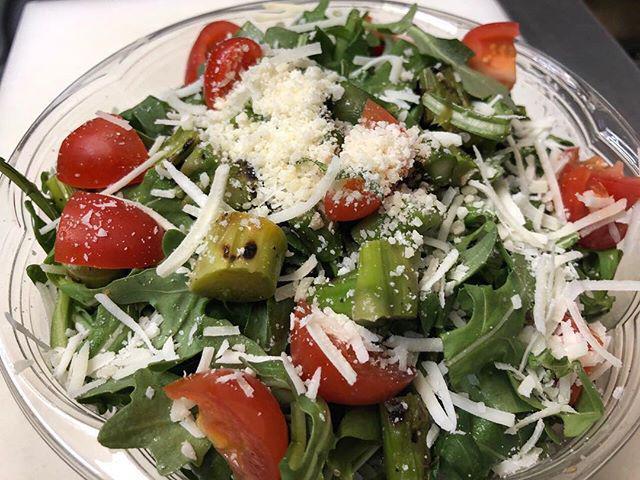Asparago Salad · Grilled asparagus, arugula and cherry tomato topped with shaved Parmigiano Reggiano cheese and lemon olive oil dressing.