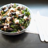 Kale and Fig Salad · Kale, figs, goat cheese and walnuts topped with reduced balsamic.