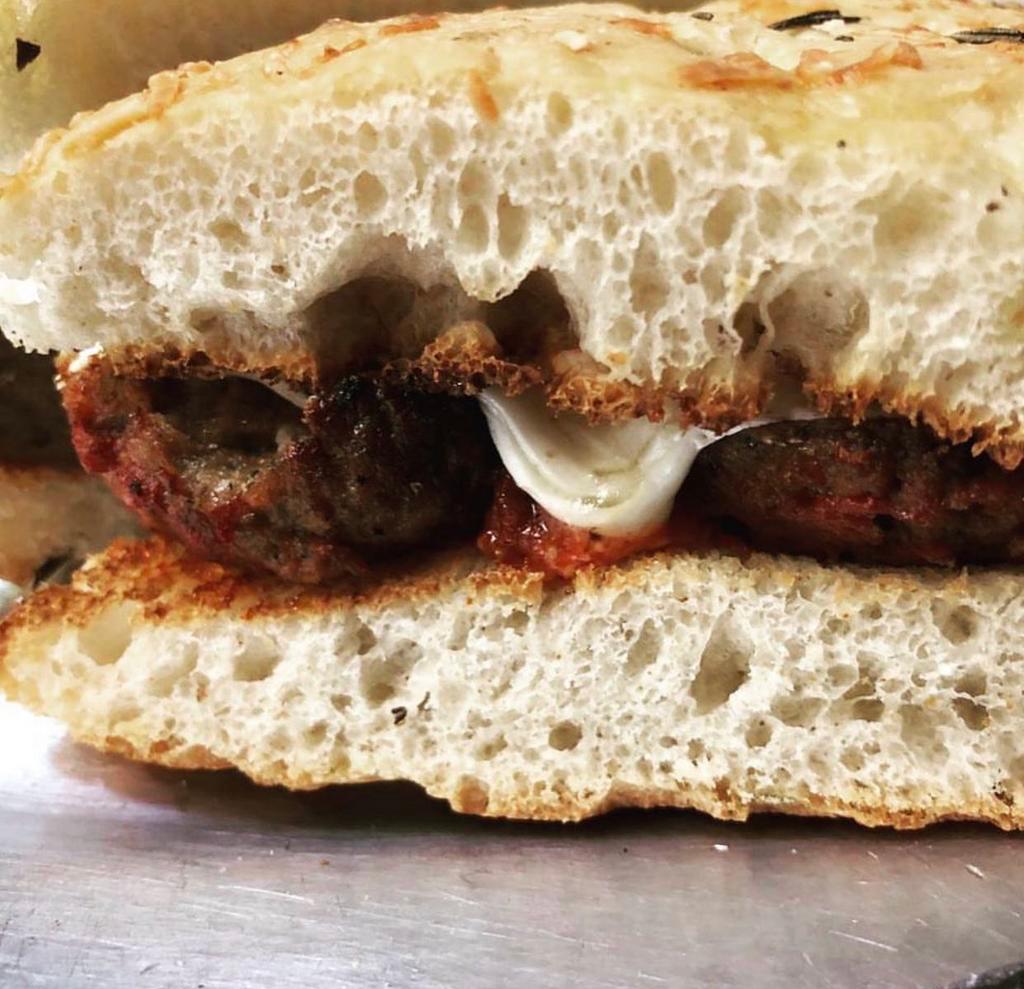 Polpettone Panini · Meatball Parmigiano. Homemade marinara sauce, fresh basil and mozzarella cheese topped with Tuscan olive oil and aged Parmigiano Reggiano. Served on homemade rosemary focaccia bread.