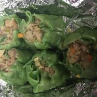 6. Dumplings · Steamed or fried. Ground pork and shrimp and water chestnuts in vegetable wrapper. Served wi...