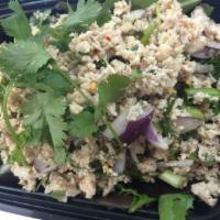 25. Larb Kai · Chicken, onion, cilantro, scallions and rice powder in lime vinaigrette.