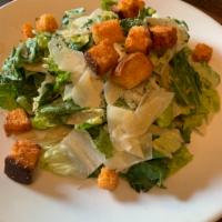 Caesar Salad · Romaine, shaved parmesan, croutons & Caesar dressing.
