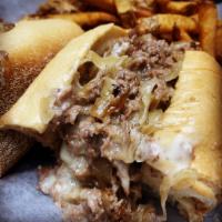 Philly Cheesesteak · Sliced beef sirloin, American cheese & sauteed onions, Amoroso's hoagie roll.