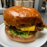 Buttermilk Fried Chicken Sandwich · Hand battered chicken breast, applewood smoked bacon, cheddar, pickles, lettuce & chipotle m...