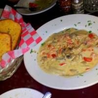 Jumbo Lobster Ravioli · Served in a pink vodka cream sauce topped with pecorino-romano cheese. Served with homemade ...