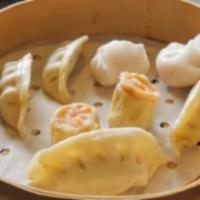 Combination Steamed Dumplings · 8 Pieces. 2 Chicken Dumplings, 2 Shrimp Dumplings, 2 Vegetable Dumplings and 2 Shiu Mai