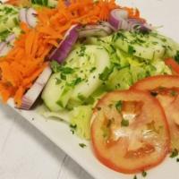 Garden Salad · Iceberg lettuce, tomatoes, cucumbers, carrots, onions, with signature house dressing.