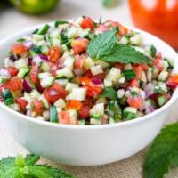 Shirazi Salad · Chopped cucumbers, tomatoes, and onion with house dressing.
