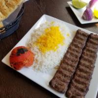 Kabob Koobideh · Served with a choice of salad or basmati rice with saffron. A grilled mixture of chopped lam...