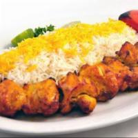 Jujeh Kabob · Served with a choice of salad or basmati rice with saffron. Marinated and grilled pieces of ...