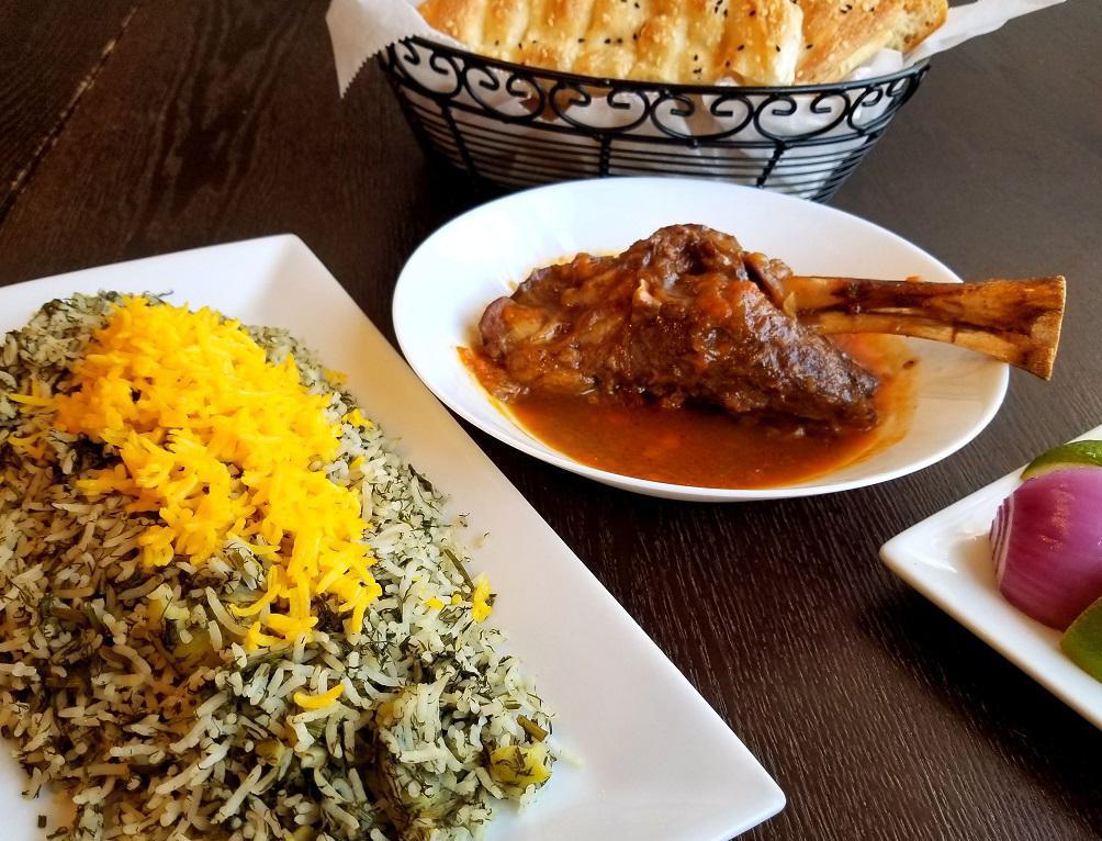 Baghali Polo with Lamb Shank · Basmati rice cooked with lima beans and dill over lamb shank.