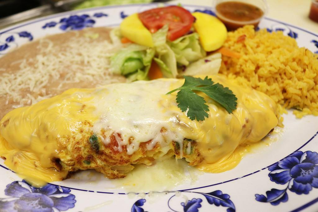 Omelette a la Mexicana · 3 eggs, mixed with chopped tomato, onion, jalapeño, topped with American cheese and Monterey cheese, served with refried beans, rice and salad.