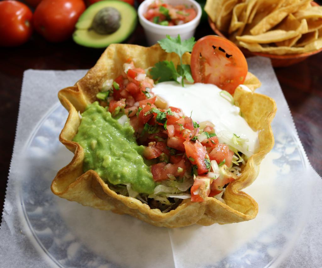 Taco Salad · Hardshell tortilla bowl, filled with your favorite meat choice refried beans, rice, cheese, pico de gallo, lettuce, fresh guacamole, and sour cream. Add extras for an additional charge.