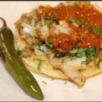 Taco de Pescado · Soft corn tortilla filled with grilled swai fillet, onion, cilantro, and tomato salsa. Add e...