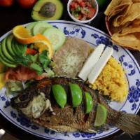Mojarra Frita · A whole mojarra fish ungutted, slightly spiced and slowly fried till crispiness served with ...