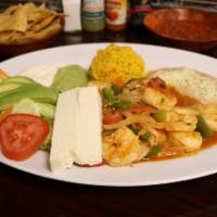 Camarones Rancheros · Delicious jumbo shrimp grilled with fresh jalapeno, onion and tomato served with salad, rice...