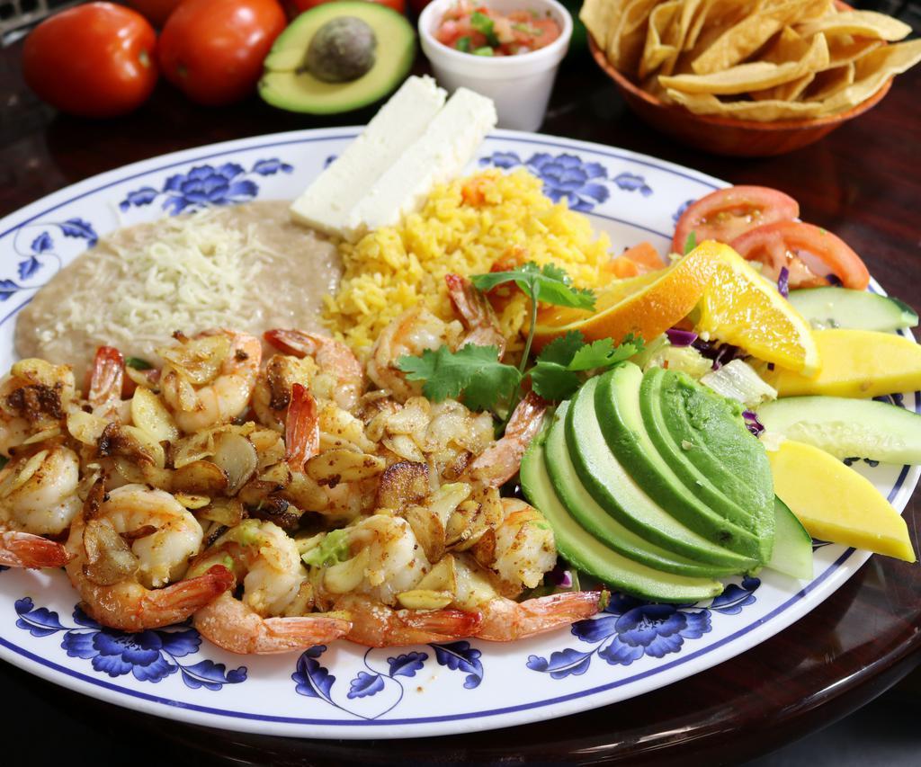 Camarones al Mojo de Ajo · Fresh shrimp sauteed with garlic and salt served with salad, rice, refried beans, cheese, and fresh guacamole.