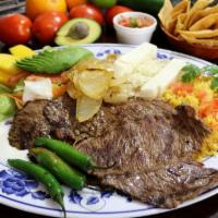 Carne Asada · Tender grilled steak ball tip beef lightly spiced, served with salad, refried beans, rice, f...