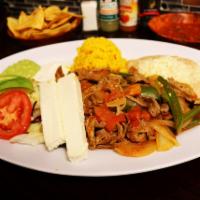 Steak Ranchero · Delicious thin steak slices grilled with fresh jalapeno, onion and tomato served with salad,...
