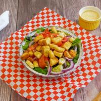 House Salad · Crisp romaine lettuce, red onion, tomato, black olives and croutons.