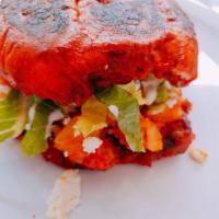 Pambazo · Mexican telera  deep into guajillo sauce and filled with potato and Mexican sausage (Papas c...