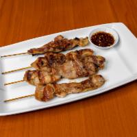 A5. Grilled Pork · 1 of famous Thai Street Foods grilled pork marinated in house special sauce.