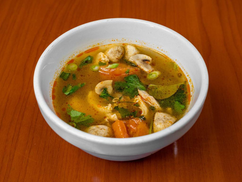 S1. Tom Yum Soup · Thai hot and sour soup. Thai famous food you must try! Choice of chicken, tofu, shrimp or seafood with mushrooms, tomatoes, kaffir lime leaves, chili, lime juice, lemongrass and cilantro. Extra charge for shrimp or seafood.