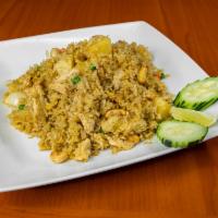 FR3. Pineapple Fried Rice · Pineapple, raisins, cashew nuts, onions, carrots, peas and curry powder.