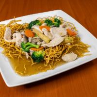 N5. Gravy Noodle · A bed of stir-fried flat rice noodle or crispy egg noodle topped with your choice of meat, b...