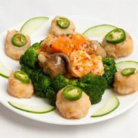 Spicy Scallops and Shrimp (mild hot) · Piquant chili-flavored scallops surrounding a core of sauteed shrimps. Spicy.