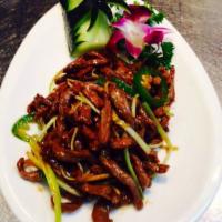 Volcano Beef (mild hot) · Tender shredded steak stir-fried among fiery chili peppers with touches of ginger and garlic...